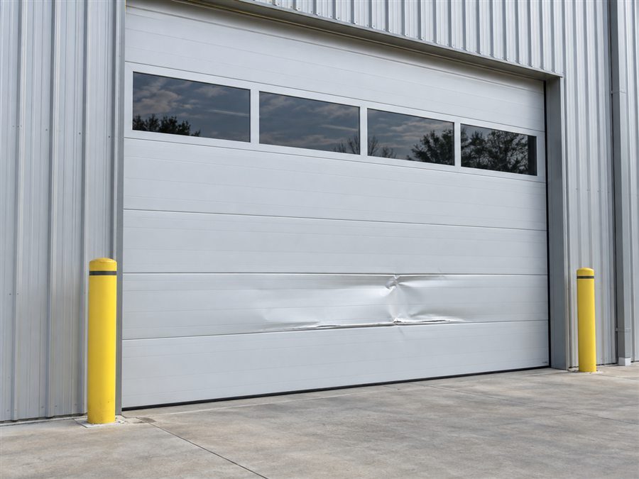 Dented sectional commercial door panel